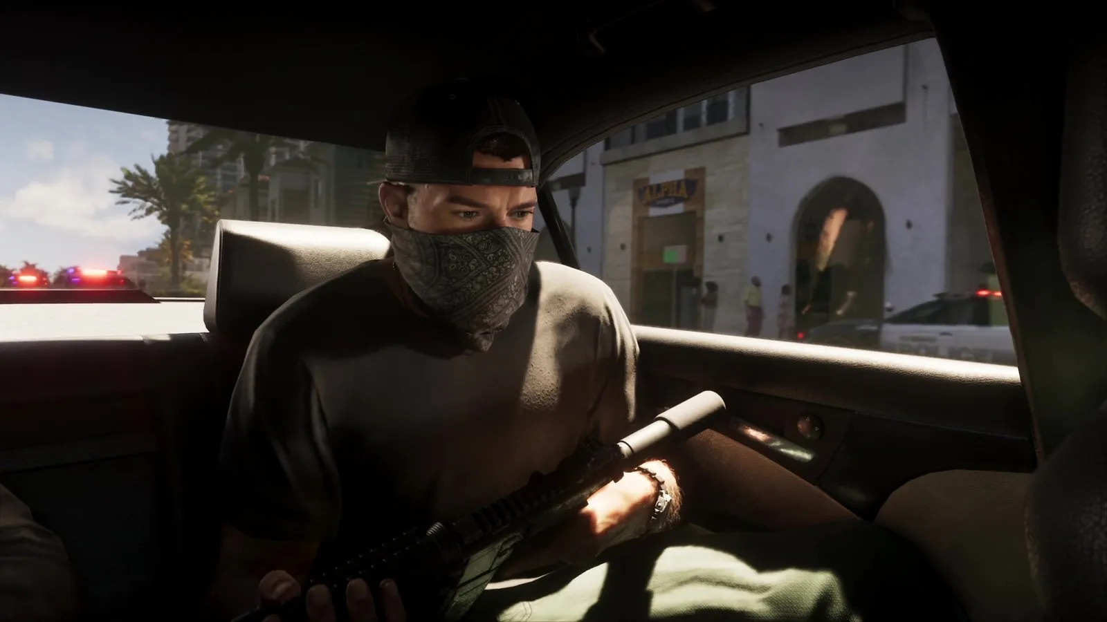A masked man holding a rifle rides in the back seat while a police SUV passes the side window and more police cars follow with lights flashing.