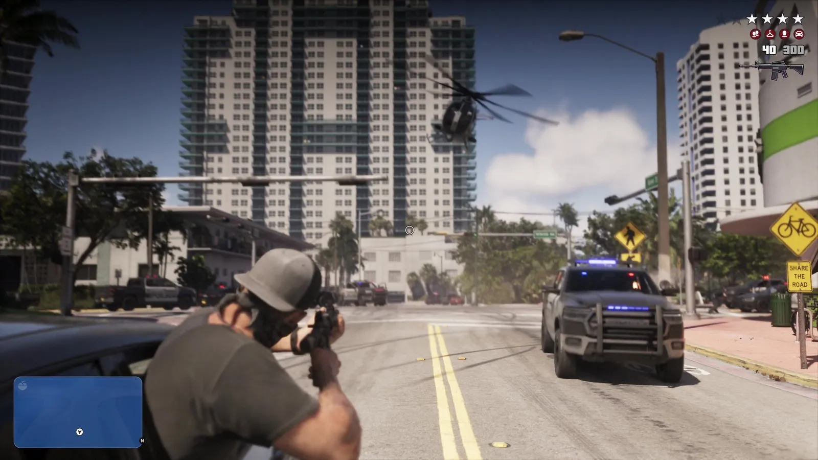 A police pickup is stopped at the roadside as a masked shooter fires at police down the street.