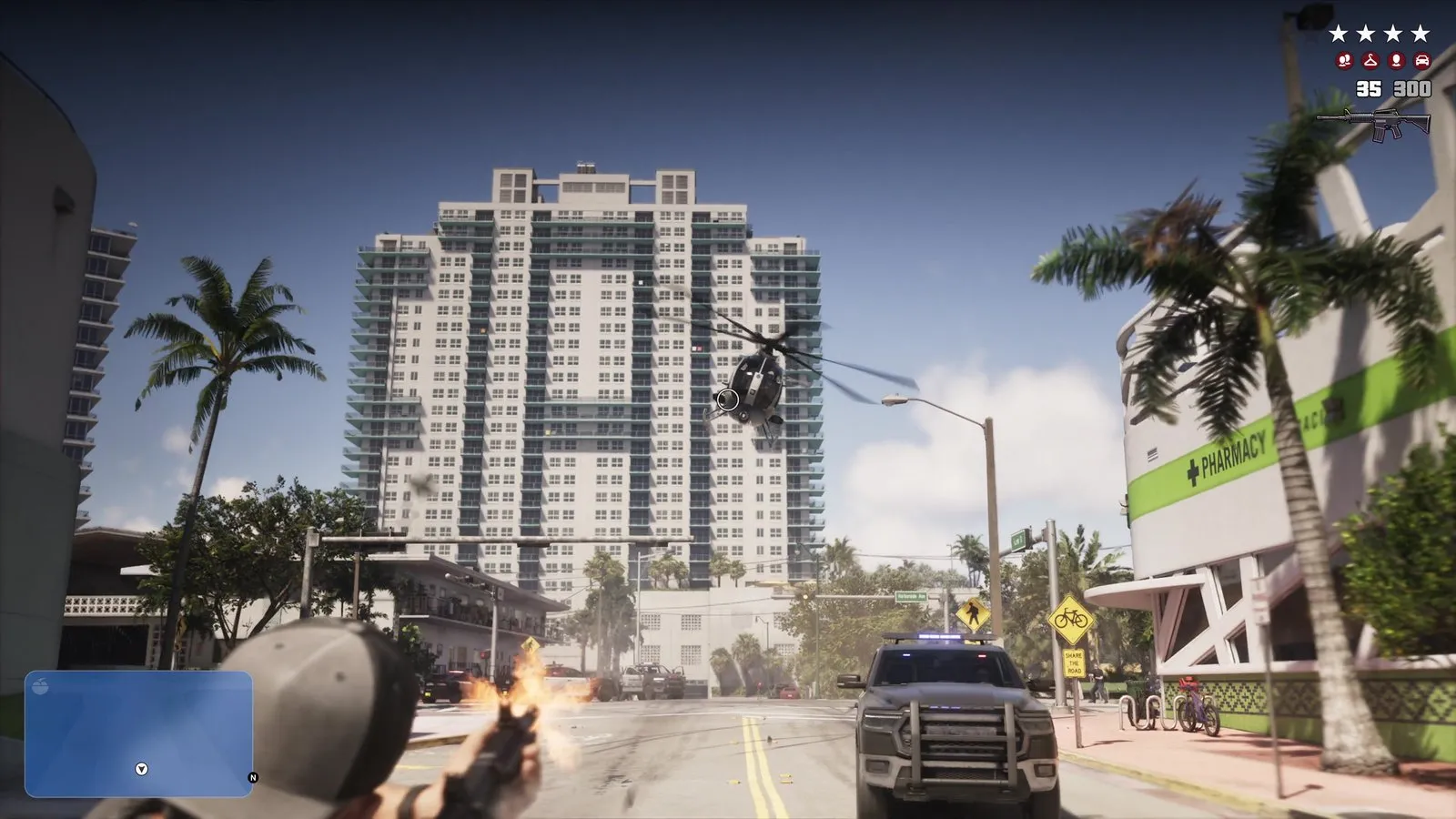 A shooter aims a rifle at a helicopter hovering over the street as a police pickup drives toward him.