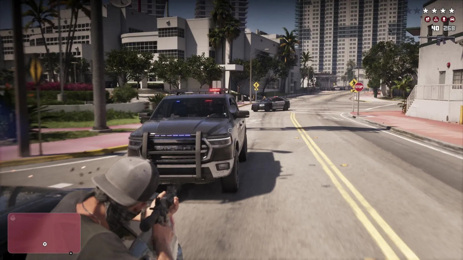 Vehicles are stopped at the far end of the street where police cars formed a roadblock.