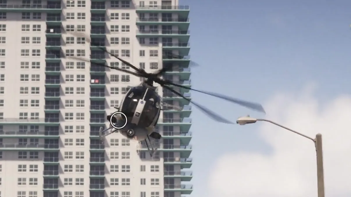 Close-up: black fuselage with a white side stripe and a small white badge