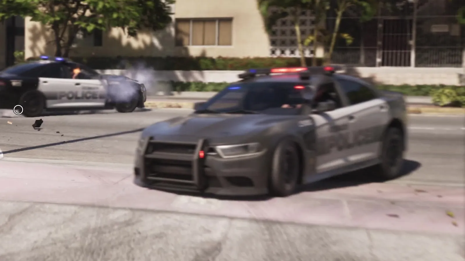 Close-up: dark gray body with a light gray door section and gray POLICE lettering, black push bar