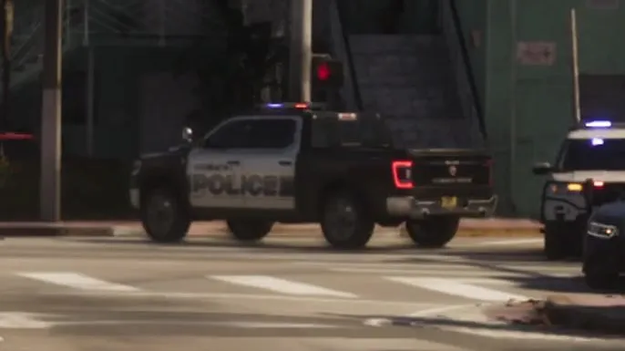 Close-up: black front and bed with white doors, large black POLICE lettering on the door