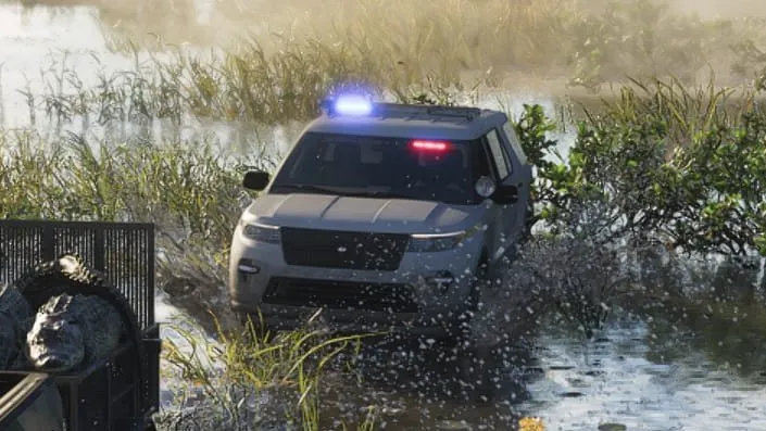 Close-up: light silver or gray body with a black grille and lower front bumper, no markings visible from the front