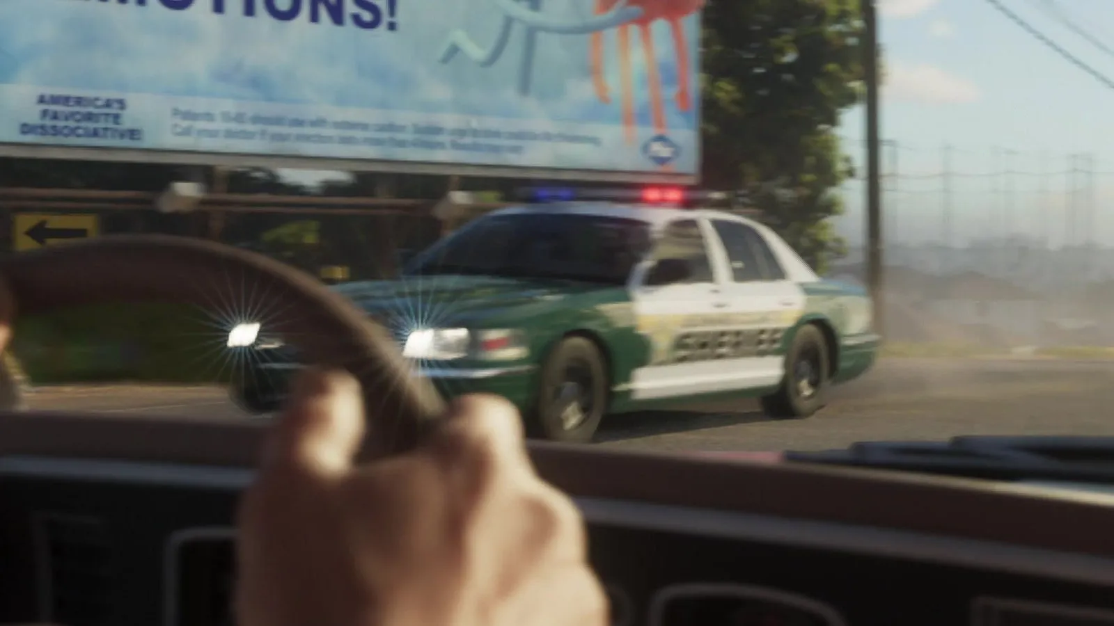 Close-up: green hood and front fenders, white roof and doors with green lower trim and green SHERIFF lettering on the doors