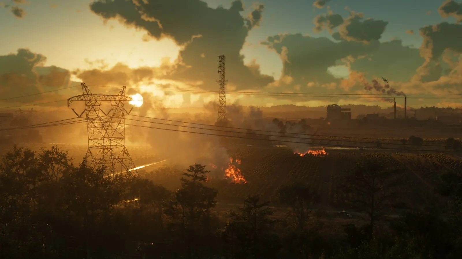 A dark vehicle sits on a dirt road below burning crop fields at sunset, with smoke drifting toward a distant factory.