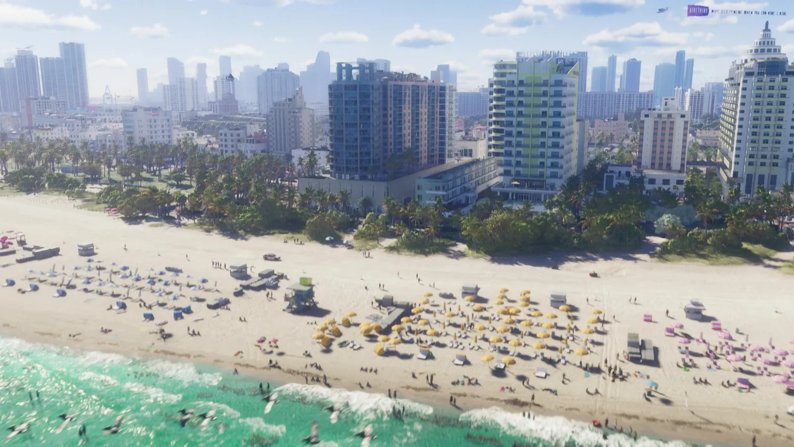 A white pickup with a red lower stripe drives on the sand behind rows of umbrellas on a busy beach, seen from the air.