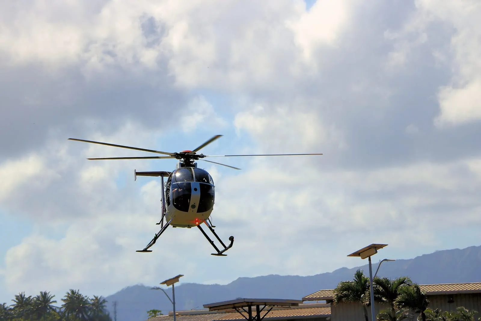 Real world photo for comparison: MD 500E Helicopter landing Kauai.